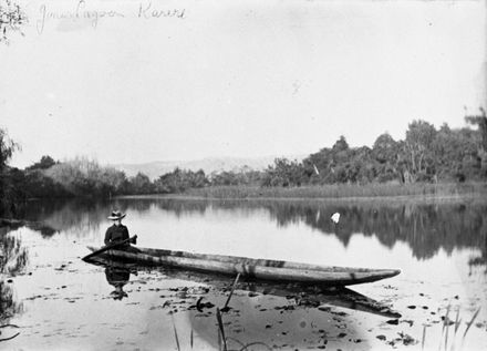 Woman paddling a dugout canoe on Jones' Lagoon, Karere