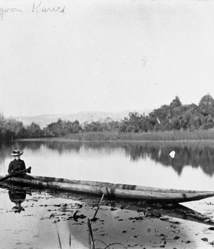 Woman paddling a dugout canoe on Jones' Lagoon, Karere