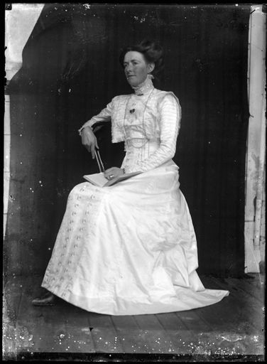 Young Woman Reading on Porch