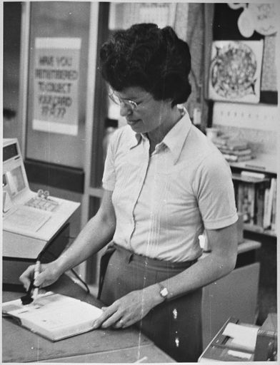 Diana Pipke demonstrating a new issuing system at Palmerston North Public Library