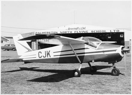 CJK Bolkow aircraft in front of the Palmerston North Flying school building
