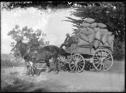Man Driving Loaded Horse and Cart