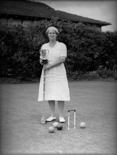 Unidentified Woman Holding Trophy