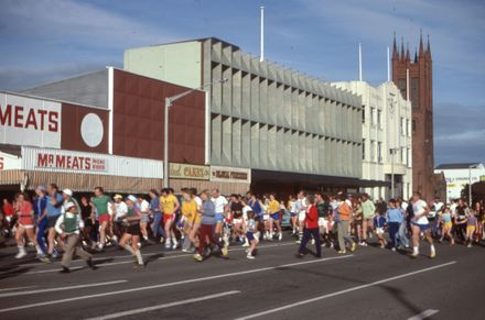 Runner Passing the Buildings on the South Side of the Square