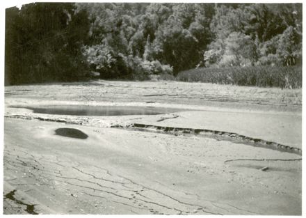 The old reservoir depleted of water and full of mud