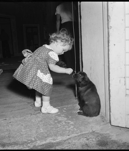 "One of Her First Admirers" [Girl with Dog]