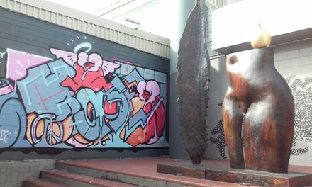 Paul Dibble's 'The Garden' and mural by Haser displayed outside the Civic Administration Building