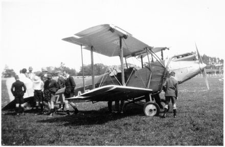 A group of school children inspecting an aeroplane