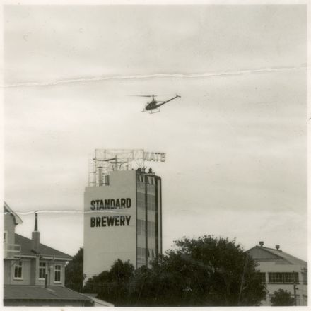 2021P_LionBreweries2-6-1_036070_003 - Helicopter Used in Installation of Standard Brewery Sign