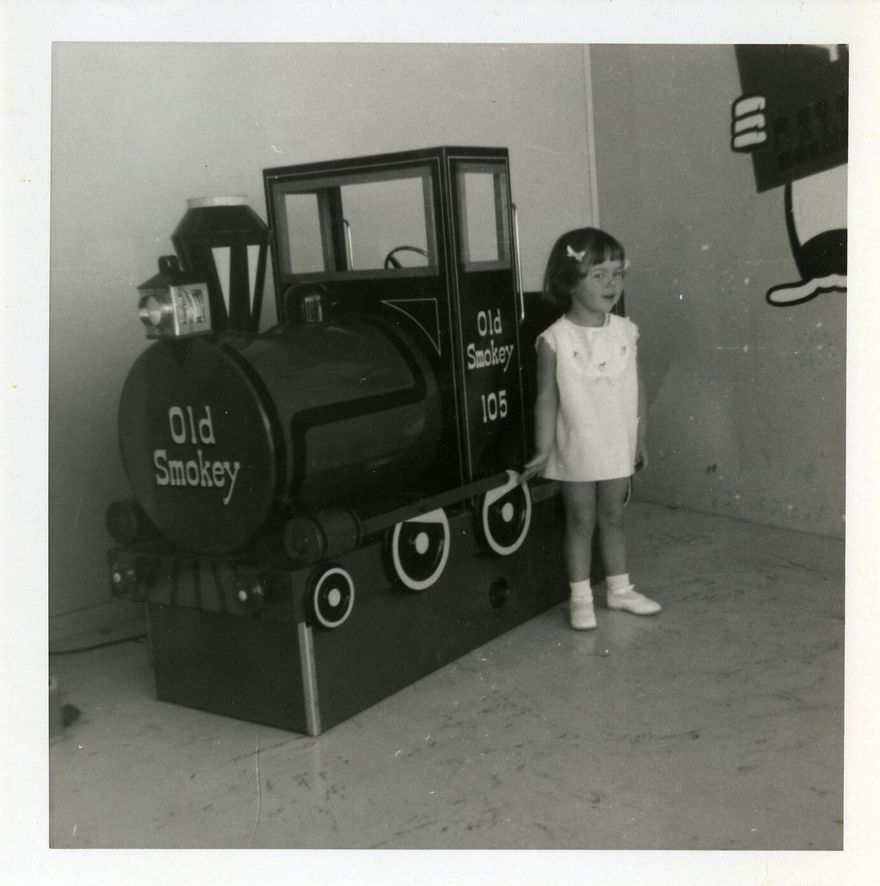 2023P_IMCA-DigitalArchive_041888_002 - Child with 'Old Smokey' at the Pioneer Village shopping centre