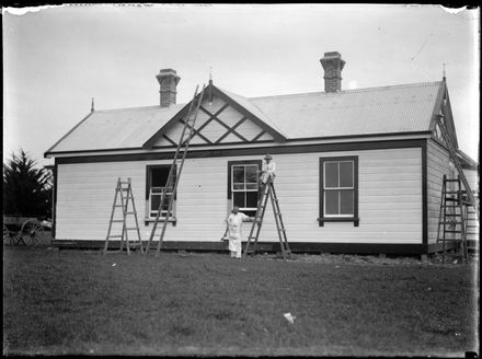 Men Painting House