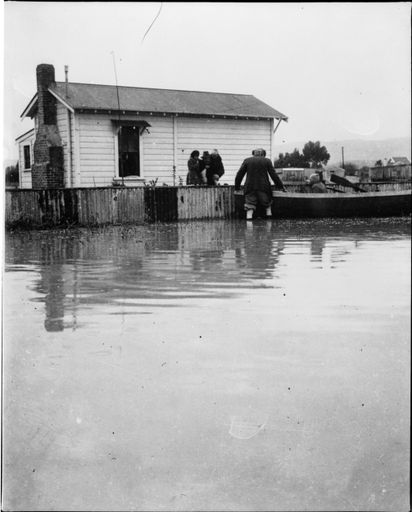 Evacuating house in flood