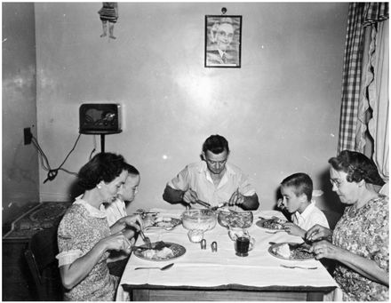 Evans Family Collection: Evans family eating dinner, 5 Mansford Place