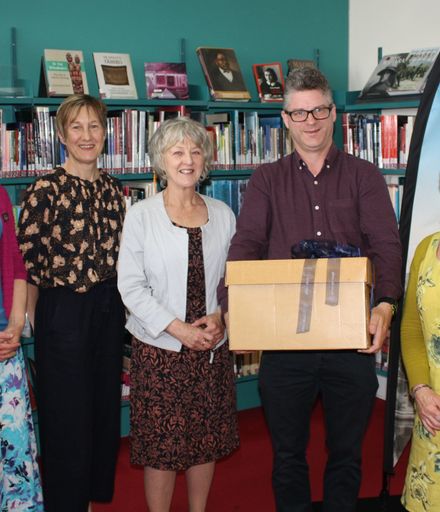 Massey University Library presenting manuscripts to Palmerston North City Libraries