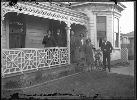 Unidentified group outside villa