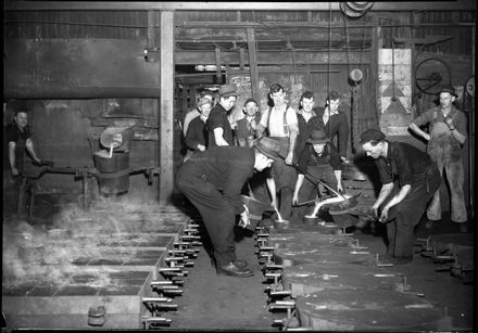 Workmen casting at A F Martin, 648-660 Main Street