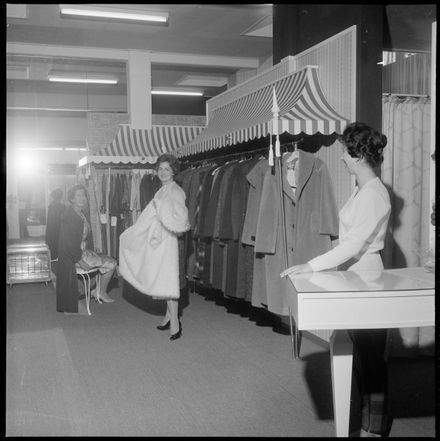 "Be Fashion Wise" Women Trying on a Selection of Coats