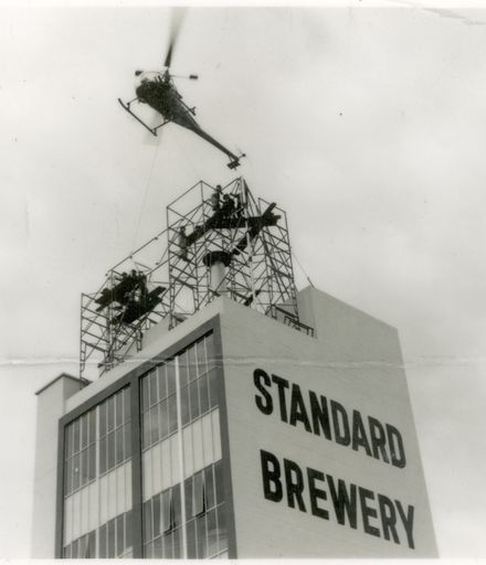 2021P_LionBreweries2-6-1_036068_009 - Helicopter Delivering Framing for Standard Brewery Sign