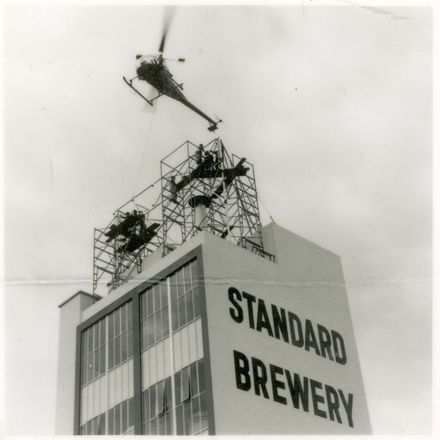 2021P_LionBreweries2-6-1_036068_009 - Helicopter Delivering Framing for Standard Brewery Sign