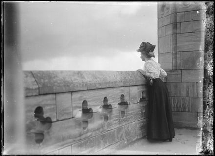Woman Looking Over Parapet