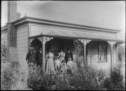 Family Group Outside Cottage