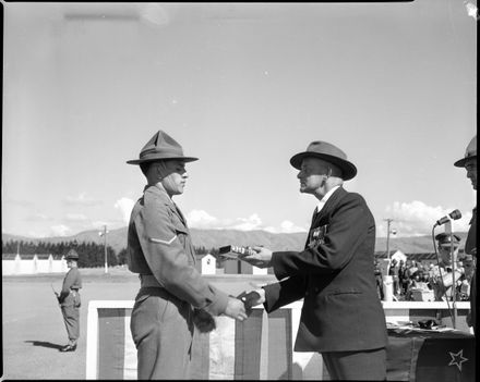 War Veteran Presents a Book to a Soldier, 23rd Intake, Central District Training Depot, Linton