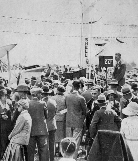 M H Oram and crowd at the opening of Manawatu Aero Club landing strip, Milson