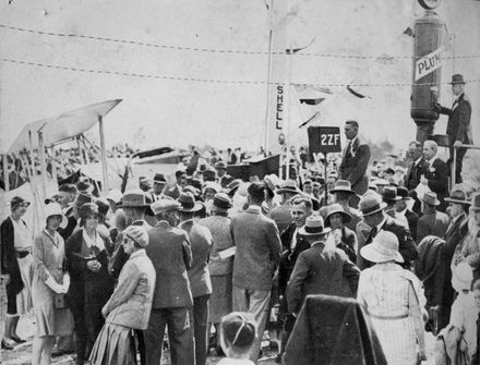 M H Oram and crowd at the opening of Manawatu Aero Club landing strip, Milson