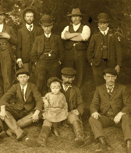 Group of men and child