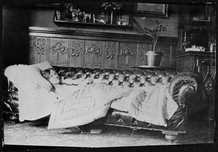 Unidentified woman reclining on a sofa - Resource cover image