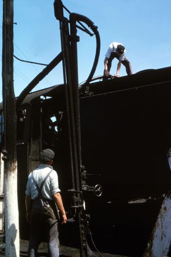 Railway Workers Fueling Locomotive