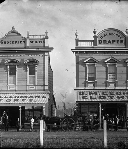 H Wollerman's wine, grocery and spirits store and D M George Drapery, The Square