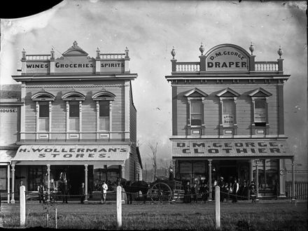H Wollerman's wine, grocery and spirits store and D M George Drapery, The Square