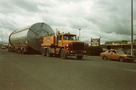 Truck towing vat on trailer