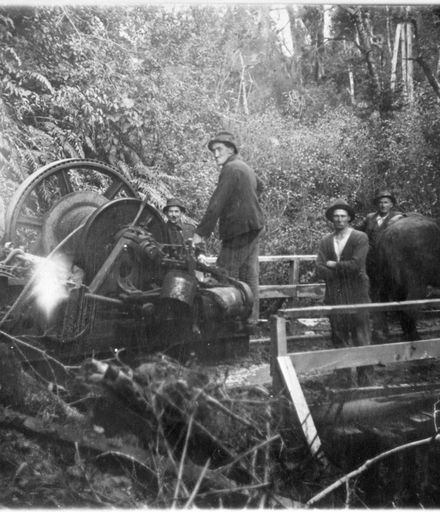 Workers with a steam driven 'log-hauler' in the bush