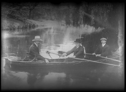 Men Canoeing on Pond