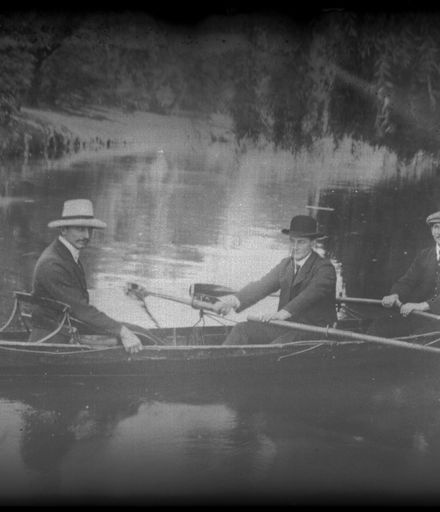 Men Canoeing on Pond