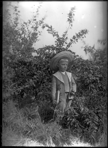 Child Holding Fruit