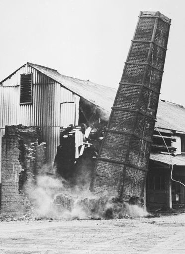 Demoliton of brick chimney at Brick and Pipes factory, Featherson Street