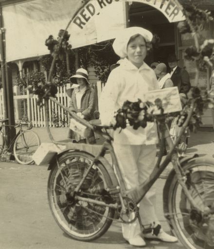 Girl with decorated bicycle in Royal Show procession