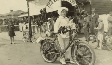 Girl with decorated bicycle in Royal Show procession