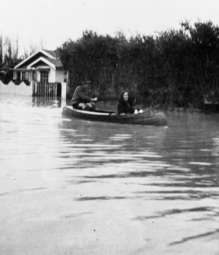 Canoeing down flooded street