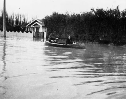 Canoeing down flooded street