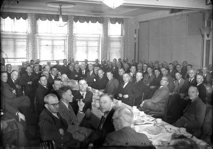 Group of men at luncheon