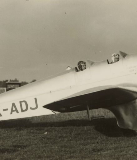 Squadron Leader McGregor and H G Walker in aeroplane at Milson Aerodrome, Palmerston North