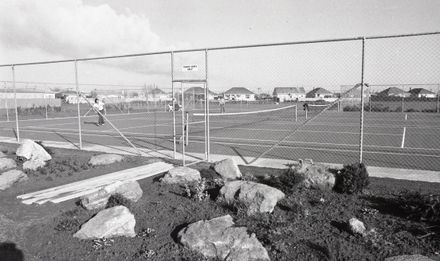 "Visitors trying out the tennis courts." [Official Opening of the Awapuni Recreation Centre]