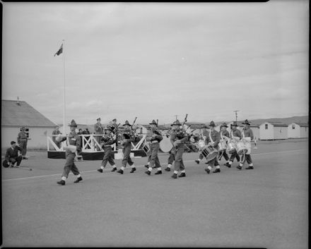 The Army Pipe and Drum Band, 22nd Intake, March Past a Platform on the Parade Ground, Linton