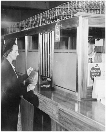 Evans Family Collection: Mrs Evans collecting the Family Benefit