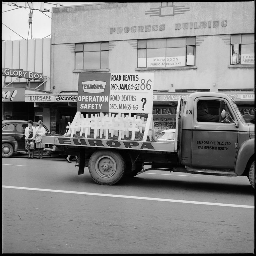 [Truck with Operation Safety signs and road fatality information driving down Broadway]