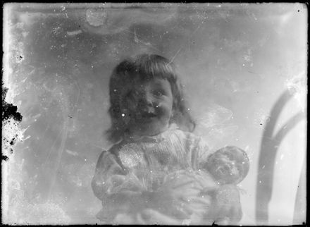 Little Girl Holding Doll